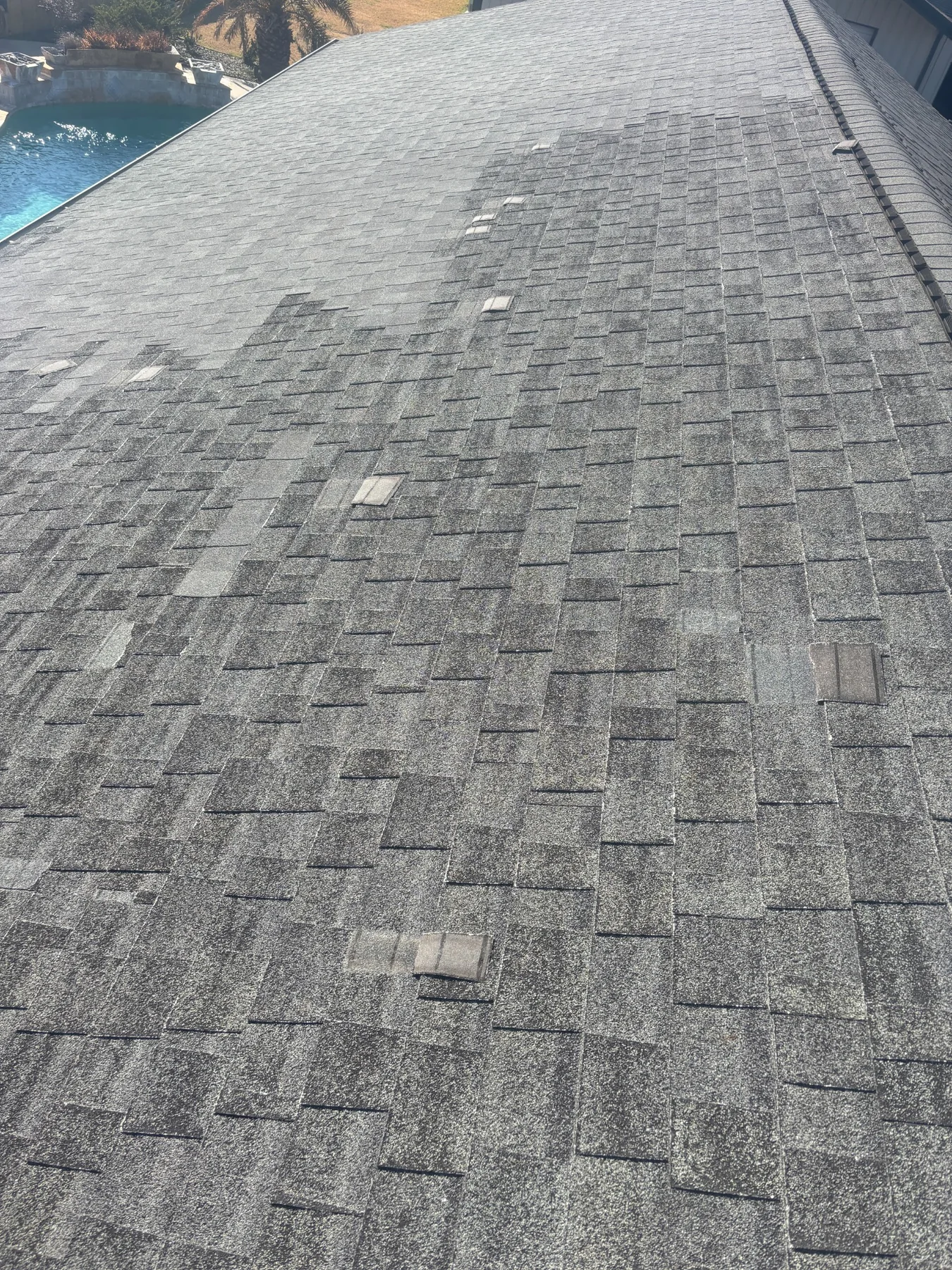 Damaged shingles found during a roof inspection in Carencro, LA