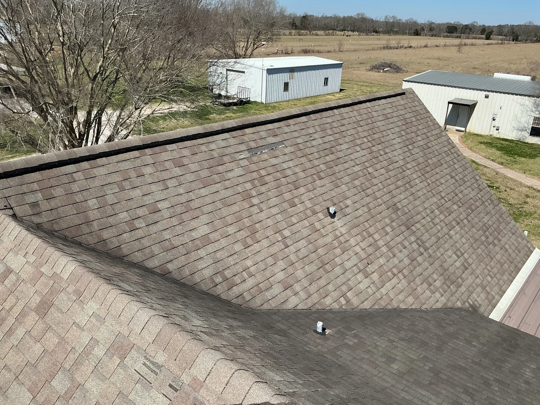 Storm-damaged shingle roof documented during an inspection in Eunice, LA