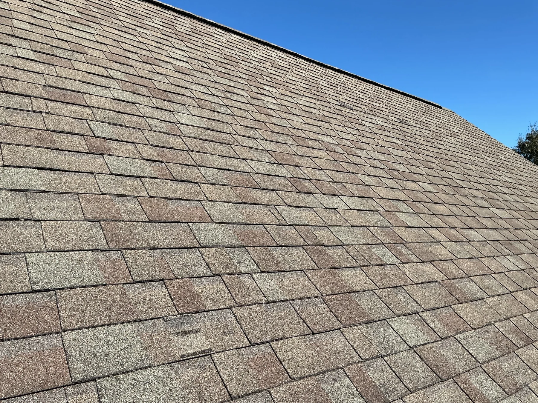 Worn shingles documented during a roof inspection in Crowley, LA